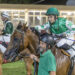 Il fantino Kledi Salvatore Tarascio accarezza Rainmaker, condotto a mano dopo la vittoria all’Ippodromo Caprilli di Livorno